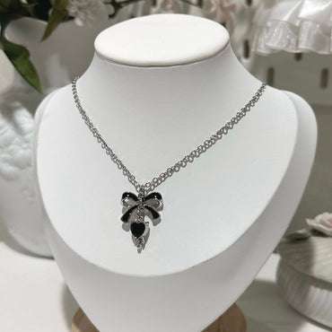 Bow charm necklace