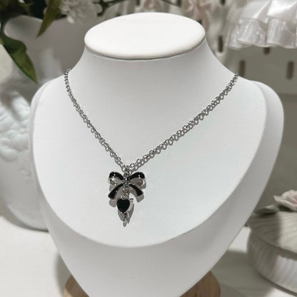 Bow charm necklace